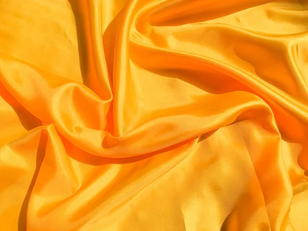 Yellow silk or satin texture background with copy space for design