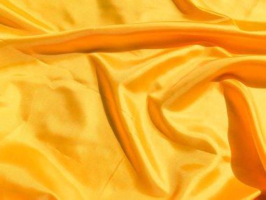 Tasarım ve sanat çalışmaları için kopyalama alanı olan güzel sarı ipek ya da saten desen arkaplanı 