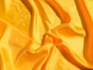 Tasarım ve sanat çalışmaları için kopyalama alanı olan güzel sarı ipek ya da saten desen arkaplanı 