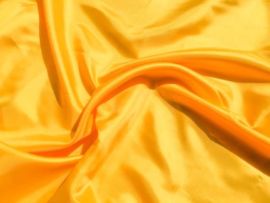 Tasarım ve sanat çalışmaları için kopyalama alanı olan güzel sarı ipek ya da saten desen arkaplanı 