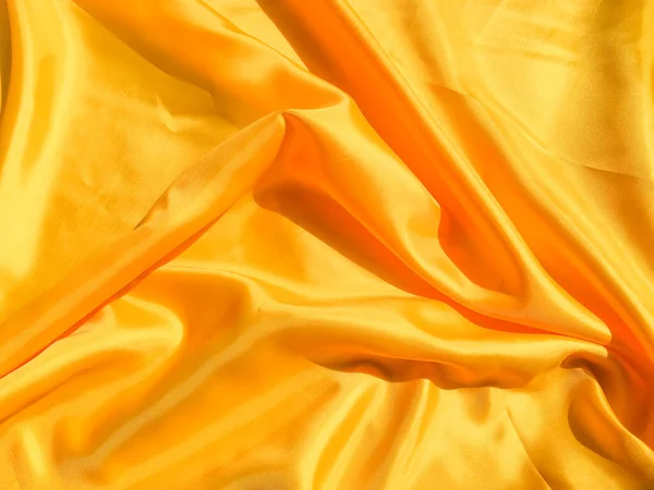 Beautiful yellow silk or satin texture background with copy space for design and artwork