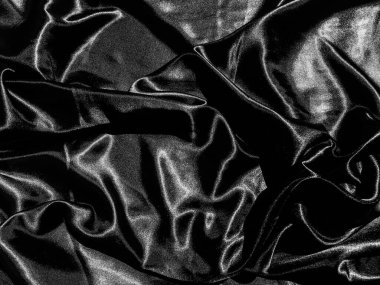 Sıvı dalga ya da dalgalı kıvrımlı siyah saten arkaplan. Duvar kağıdı tasarımı