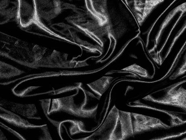 Siyah kumaş ya da kumaş arkaplanda sıvı dalga ya da dalgalı kıvrımlar. Duvar kağıdı tasarımı