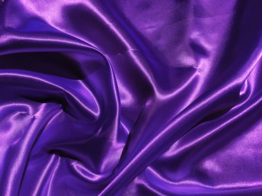 Mor kumaş arkaplanının deseni. Tasarım için dalgalı ipek kumaş kıvrımları saten kadife kumaş