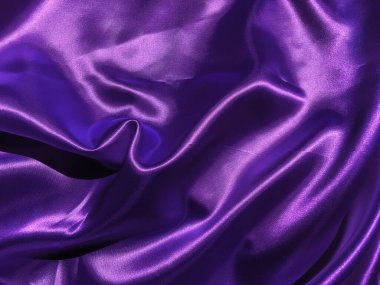 Mor kumaş arkaplanının deseni. Tasarım için dalgalı ipek kumaş kıvrımları saten kadife kumaş