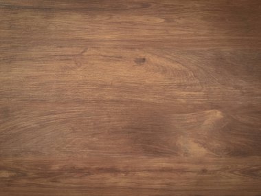 Tasarım için kopyalama alanı olan doğal arkaplan olarak ceviz ağacı ahşabı dokusu kullanılıyor. 