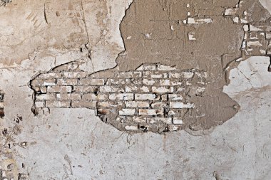 Eski tuğla duvar dokusu. Grunge beyaz duvar arka planı. Hasarlı alçılı eski püskü bir bina duvarı. Soyut