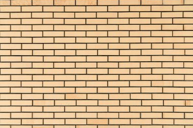 Sarı tuğlalı eski bir arka plan. Yeni tuğla duvar dokusu