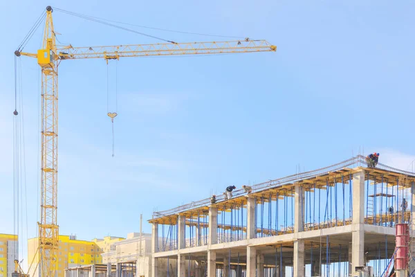 View of the construction site. Tower crane at a construction site. Monolithic frame of the building — Stock Image View Construction Site Tower Crane Construction Site Monolithic Frame Building Royalty Free Stock Photos