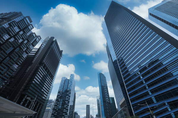Low angle view of singapore financial glass buildings.