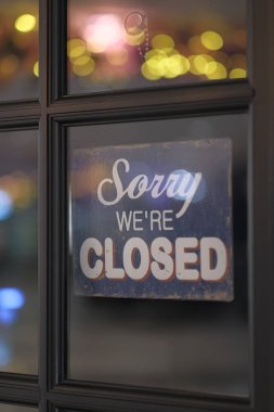 Close up of closing sign on window