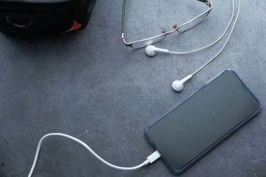 top view of smart phone charging on table 