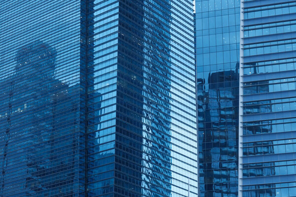 Singapore modern glass blue buildings with detail, closeup .