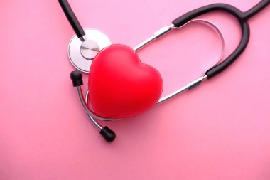 top view of heart shape symbol and stethoscope 