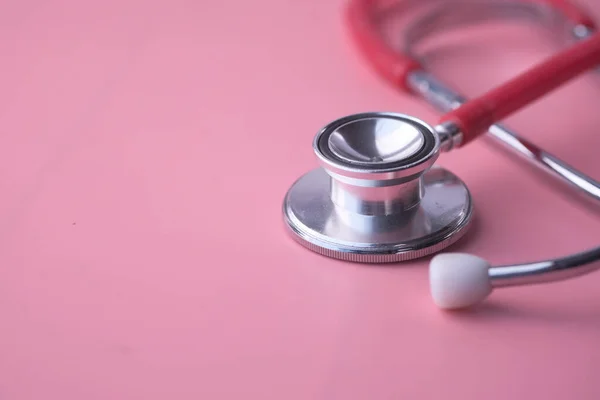 Close up of stethoscope on pink background with copy space — Stock Photo, Image