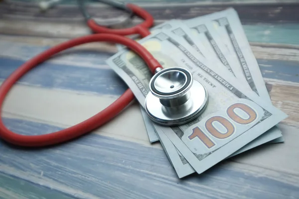 Top view of stethoscope and cash on table — Stock Photo, Image