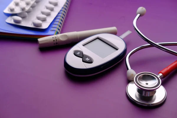  blood sugar measurement for diabetes, pills and stethoscope 