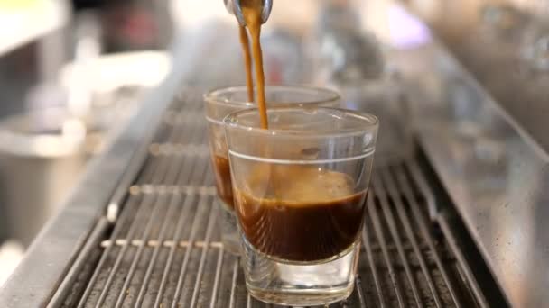 Making coffee or espresso at cafe, pouring coffee in a cup — Stock Video