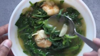 Close up of up cooked green spinach in a bowl 