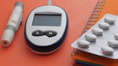  blood sugar measurement for diabetes, pills and stethoscope 