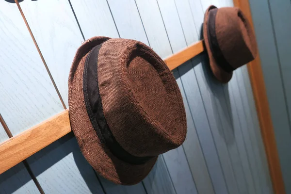 Close up of hats hanging on wall, travel concept — Stock Photo, Image