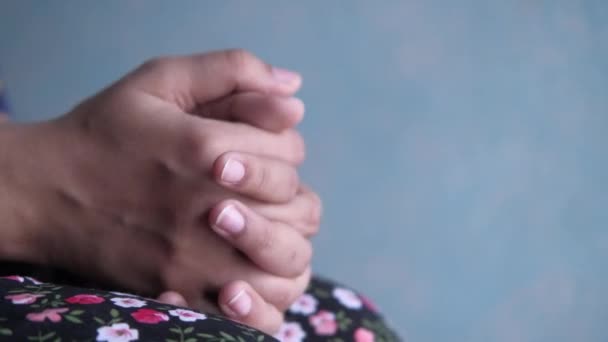 Close up view of woman folded hands. Lonely lady sitting alone — Stock Video