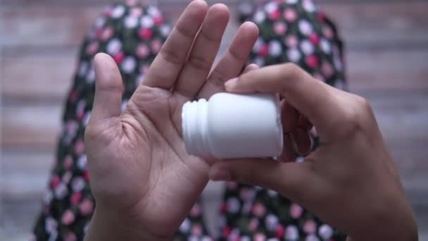 Young women hand taking pills, top view — Stock video