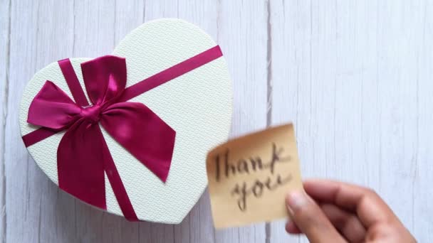 Top view of thank you message on heart shape gift box — Stock Video