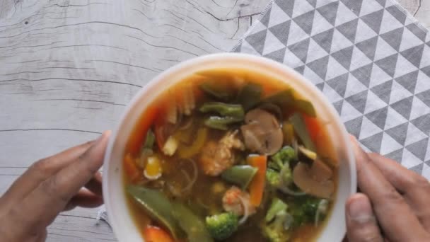 Vegetable soup in a bow on table , close up — Stock Video