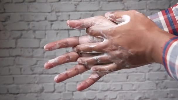 Man lathering hands with soap before washing — Stock Video