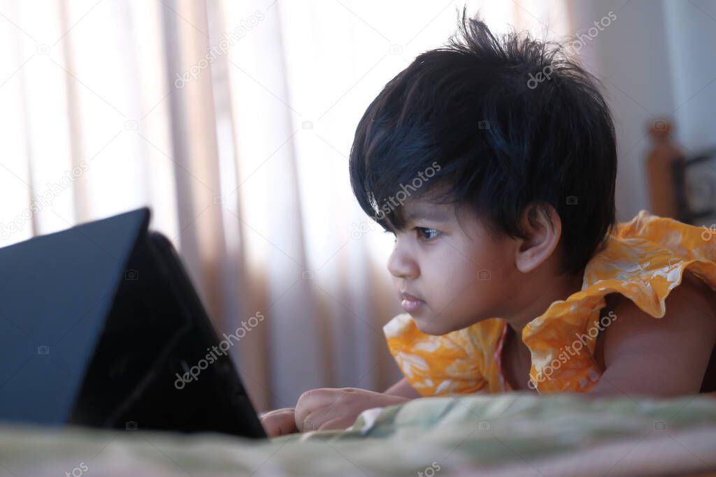 close up of baby child using digital tablet .