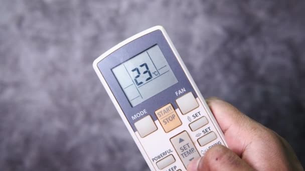 Close up of man hand using air condition remote. — Stock Video