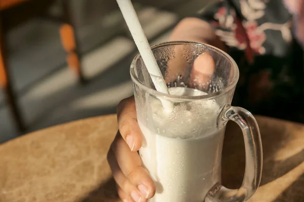 Close up of milk shake on cafe table. — Stock Photo, Image