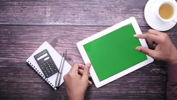 Young man working on digital tablet at office desk — Stock Video