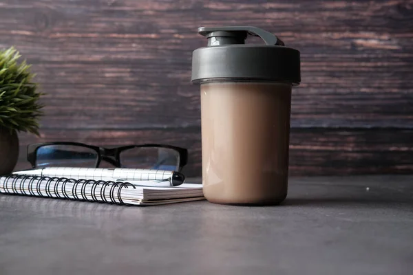 reusable eco coffee cup on table with copy space.