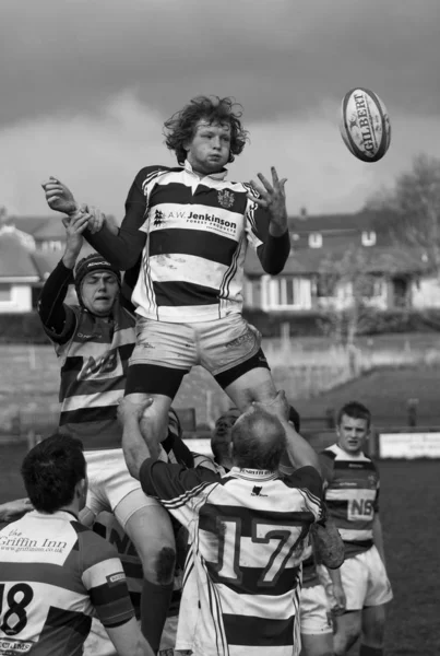 Unidentified rugby union players contest the ball in a second team match between Penrith and Liverpool St Helens, at Winters Park, Penrith, Cumbria in northern Englanda.