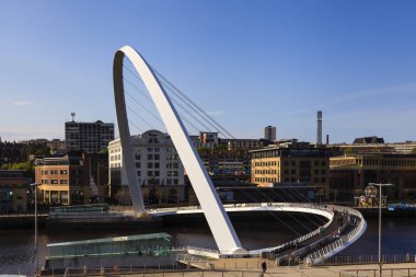 Gateshead Millennium Bridge which connects Gateshead and Newcastle upon Tyne and spans the River Tyne in north east England. clipart