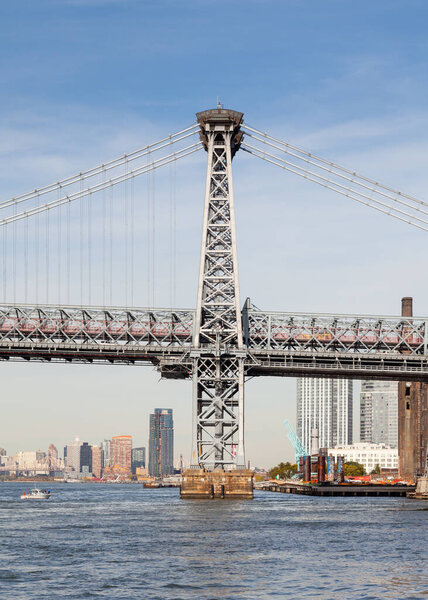 A close up view of Williamsburg Bridge in New York City in the United States of America. The bridge spans the East River connecting the boroughs of Manhattan and Brooklyn.