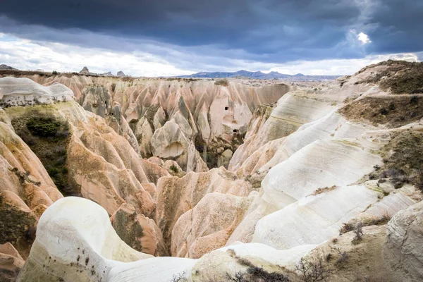 Rocky landscape of Rose valley with many colorful taxtures in a cloudy day with no people. Geological formations of Cappadocia. Stunning landscapes in Turkey.