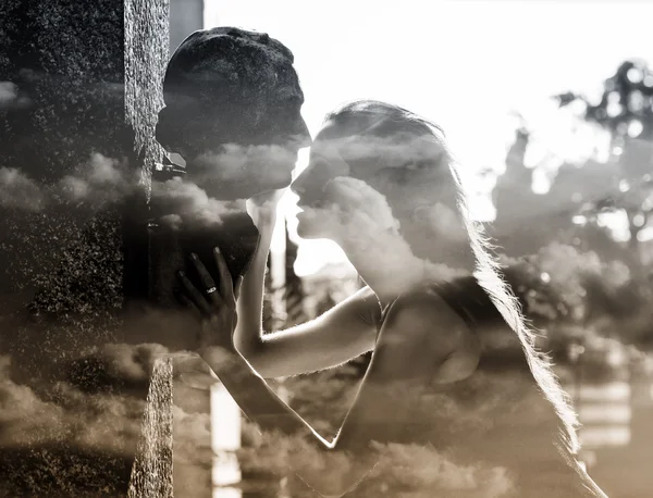 Double exposure of woman and grave stone head and cloudscape — Stock Photo, Image