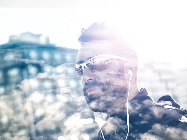 Double exposure of handsome sportsman and cloudscape — Stock Photo, Image