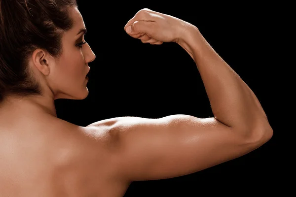 Bella donna bodybuilder ritratto posteriore che mostra i suoi muscoli — Foto Stock