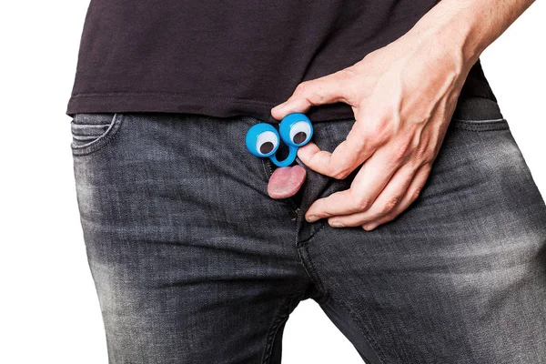 Tongue coming out of jeans zipper with funny eyes — Stock Photo, Image