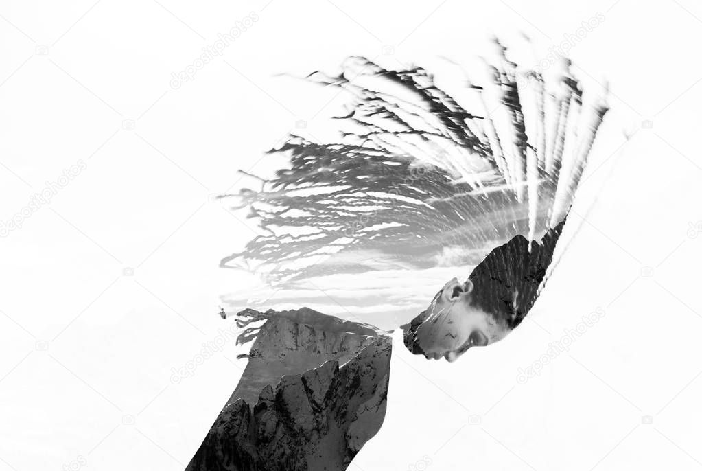 Monochrome double exposure of girl with braids and mountains