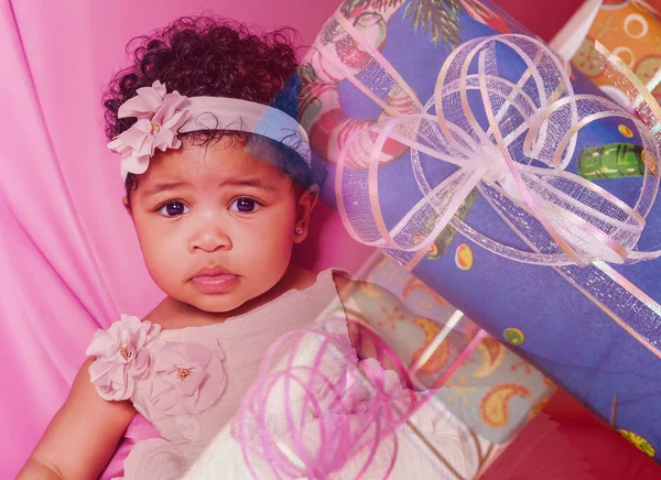 Double exposure of cute baby girl portrait and Christmas presents — Stock Photo, Image