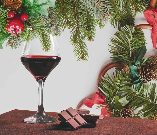 Red wine with chocolate and Christmas decorations Stock Picture