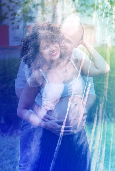 Double exposure of adorable pregnant couple and cloudscape — Stock Photo, Image