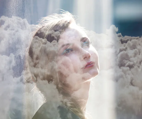 Double exposure of beautiful serene woman and cloudscape — Stock Photo, Image