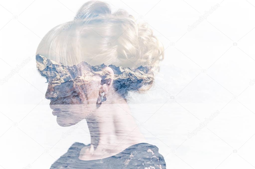 Double exposure of woman profile portrait and snowy mountains