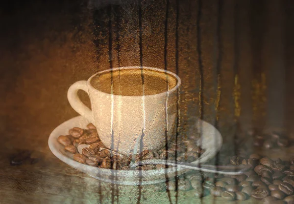 Double exposure of cup of coffee and rain on window